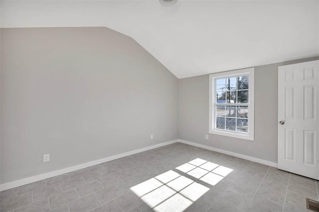 empty room with lofted ceiling