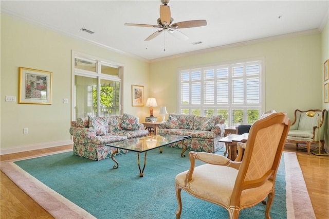 2306 Grand View Dr, Saint Simons Island, GA 31522 - living room featuring wood finished floors, plenty of natural light, a ceiling fan, crown molding, and baseboards