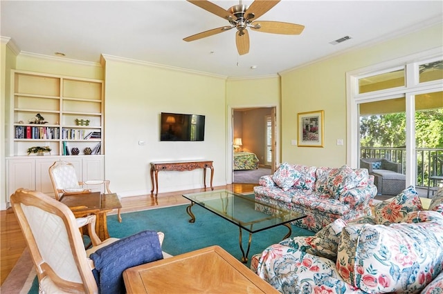 2306 Grand View Dr, Saint Simons Island, GA 31522 - living room with ornamental molding, a ceiling fan, wood finished floors, and baseboards