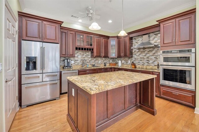 2306 Grand View Dr, Saint Simons Island, GA 31522 - kitchen with appliances with stainless steel finishes, a sink, pendant lighting, decorative backsplash, and a ceiling fan