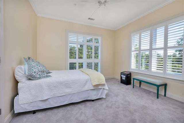 2306 Grand View Dr, Saint Simons Island, GA 31522 - bedroom with ornamental molding, multiple windows, carpet flooring, baseboards, and a ceiling fan