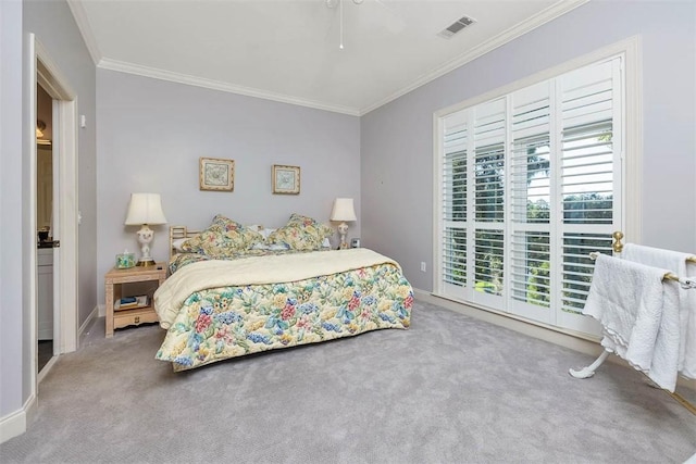 2306 Grand View Dr, Saint Simons Island, GA 31522 - carpeted bedroom with crown molding, baseboards, and ceiling fan