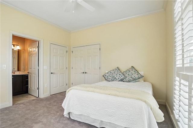 2306 Grand View Dr, Saint Simons Island, GA 31522 - bedroom featuring ornamental molding, carpet floors, multiple windows, baseboards, and a sink