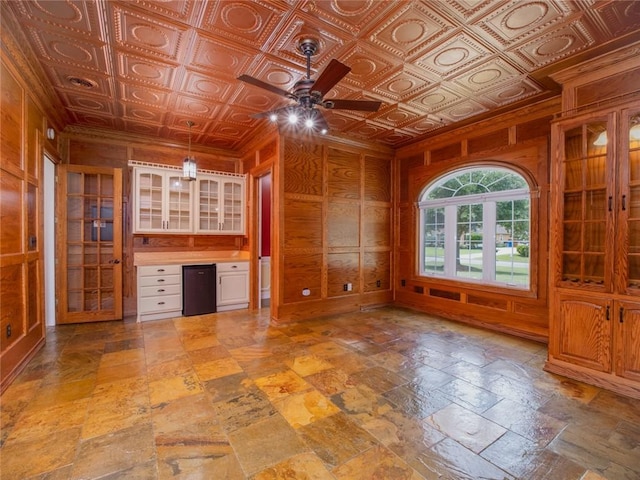 interior space with ceiling fan