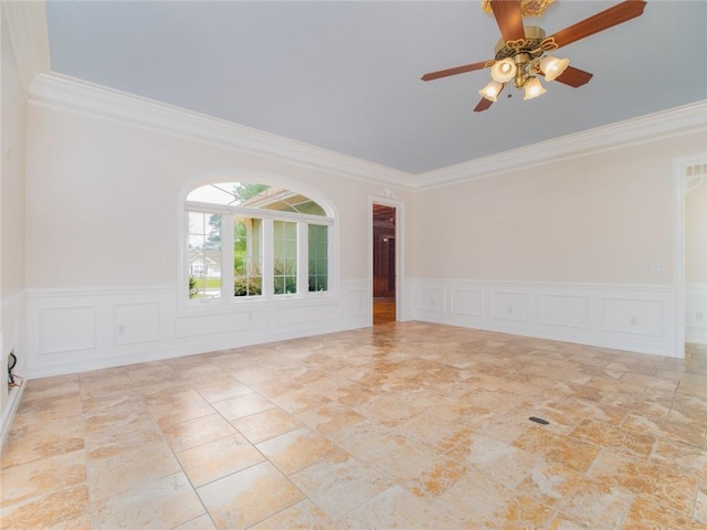 unfurnished room featuring ceiling fan and crown molding