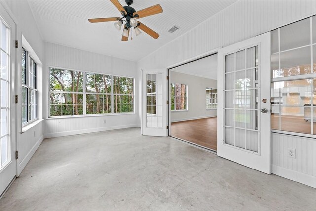 unfurnished sunroom featuring french doors, ceiling fan, and lofted ceiling