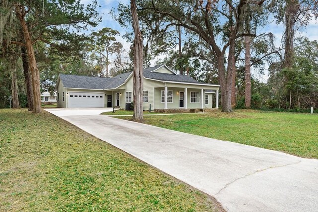 view of front of house with a garage and a front yard