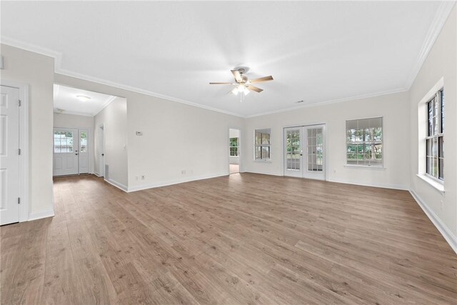 unfurnished living room featuring ceiling fan, light hardwood / wood-style flooring, french doors, and ornamental molding