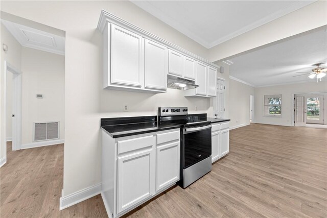 kitchen featuring white cabinets, light hardwood / wood-style flooring, stainless steel range with electric cooktop, and ornamental molding