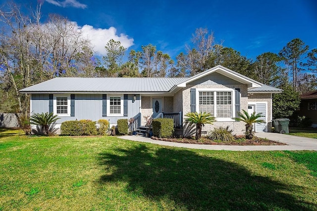 ranch-style house featuring a front yard and a garage