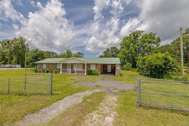 3429 US Highway 82, Brunswick, GA 31523 - single story home featuring brick siding, a porch, and a gate