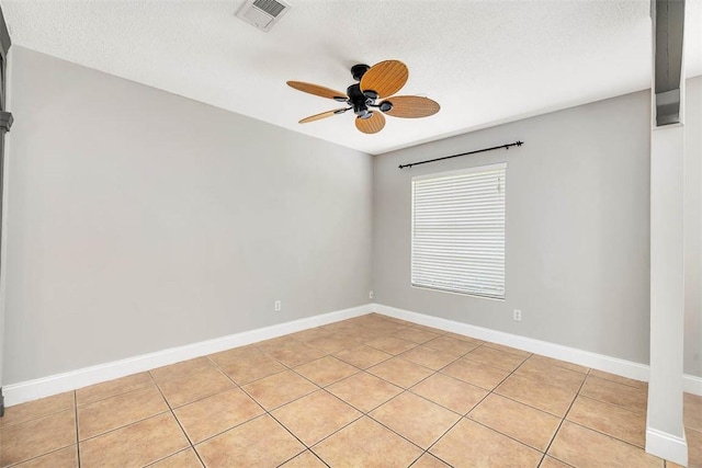 3429 US Highway 82, Brunswick, GA 31523 - spare room featuring a textured ceiling, ceiling fan, light tile patterned flooring, and baseboards