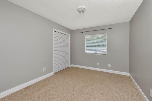 3429 US Highway 82, Brunswick, GA 31523 - unfurnished bedroom with light carpet, a closet, and baseboards
