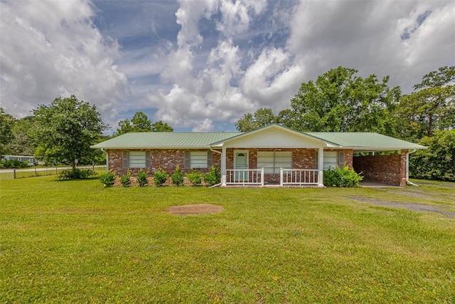 3429 US Highway 82, Brunswick, GA 31523 - ranch-style home featuring brick siding, a front yard, an attached carport, and a porch