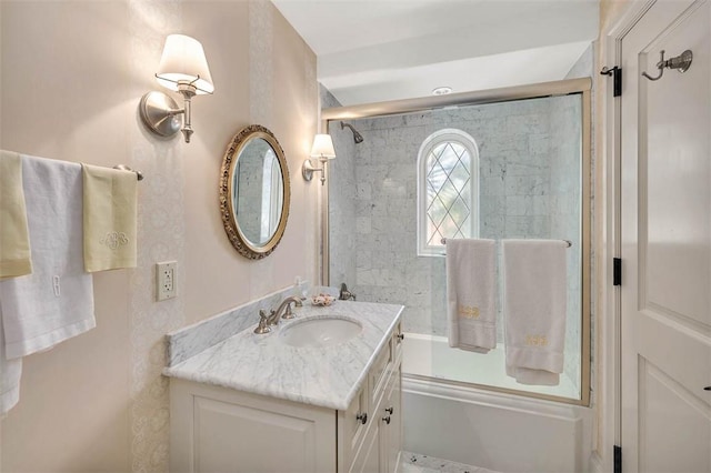 bathroom with vanity and bath / shower combo with glass door