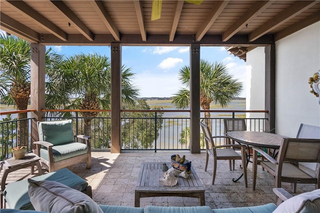 view of patio featuring outdoor lounge area and a water view