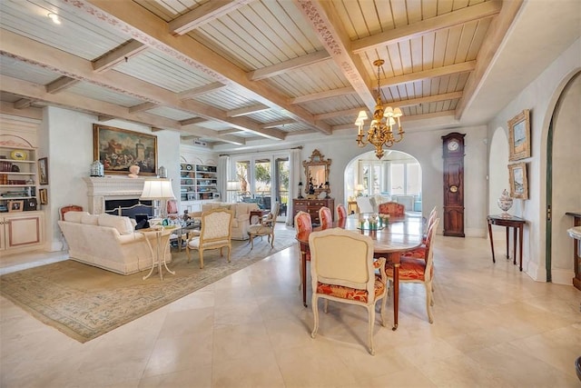 tiled dining area with french doors, wooden ceiling, coffered ceiling, beamed ceiling, and a notable chandelier