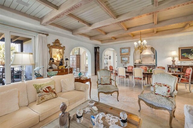 living room featuring wood ceiling, beamed ceiling, and a chandelier