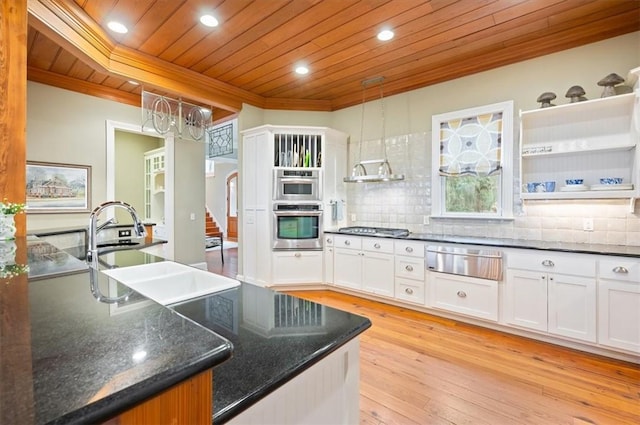 kitchen with a warming drawer, ornamental molding, a sink, tasteful backsplash, and wood ceiling