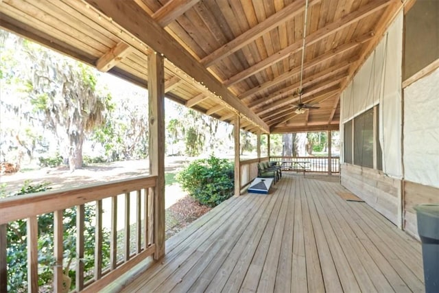 wooden deck featuring a porch and ceiling fan