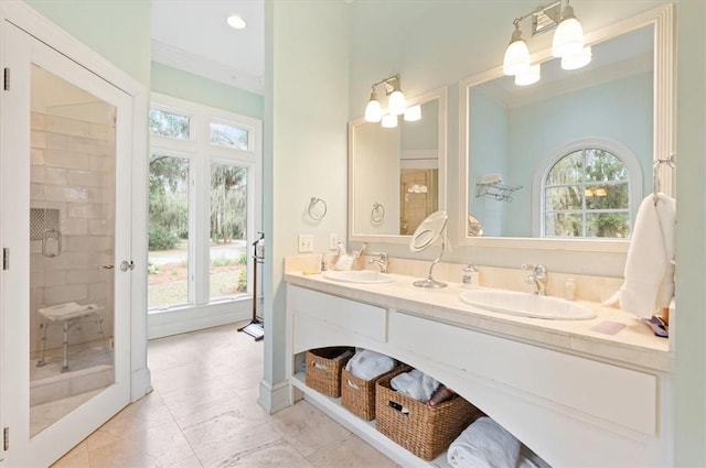 full bathroom with a sink, a stall shower, and a wealth of natural light