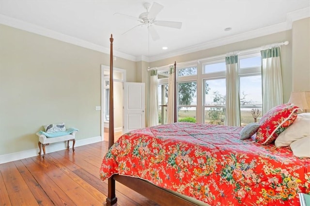 bedroom featuring hardwood / wood-style floors, crown molding, a ceiling fan, and baseboards