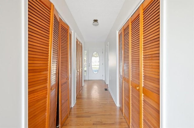 hallway with light wood finished floors