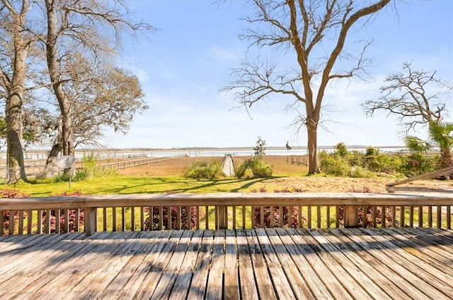 wooden terrace with a water view