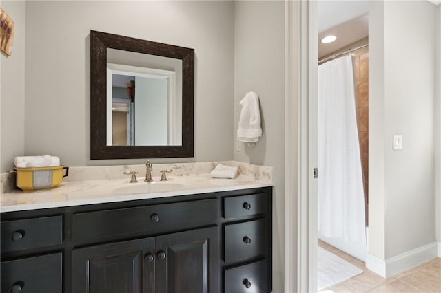 bathroom with tile patterned floors and vanity