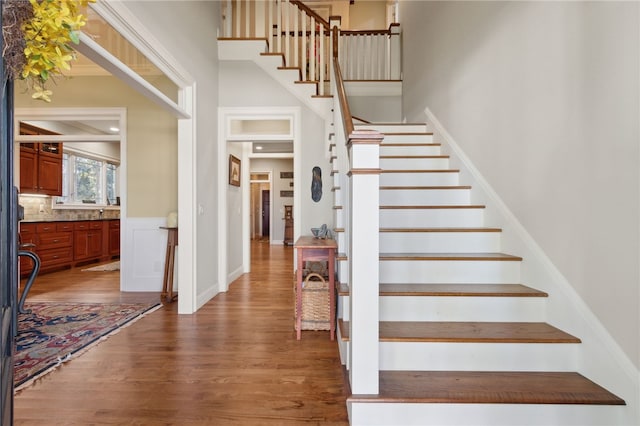 stairs featuring hardwood / wood-style flooring