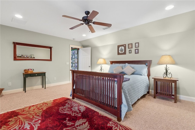 carpeted bedroom featuring ceiling fan and vaulted ceiling