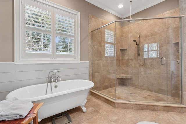 bathroom featuring tile patterned flooring, a healthy amount of sunlight, ornamental molding, and separate shower and tub