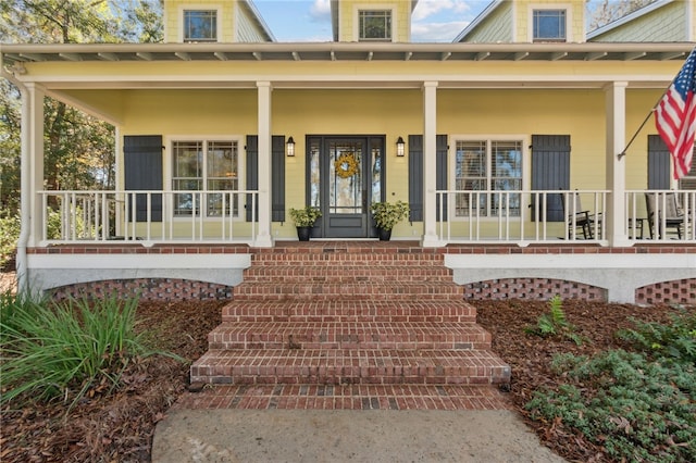 doorway to property featuring a porch