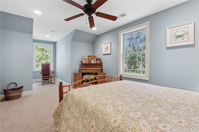 bedroom with carpet, vaulted ceiling, and ceiling fan