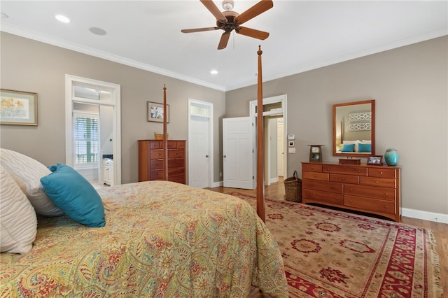 bedroom with ceiling fan, wood-type flooring, crown molding, and ensuite bath