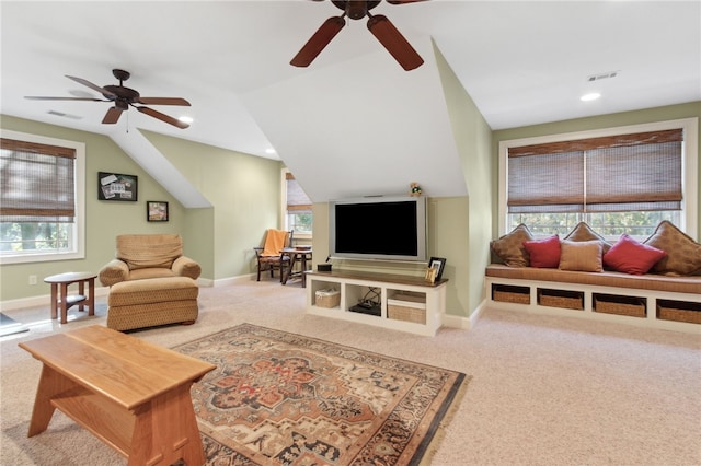 living room with ceiling fan, carpet, and lofted ceiling