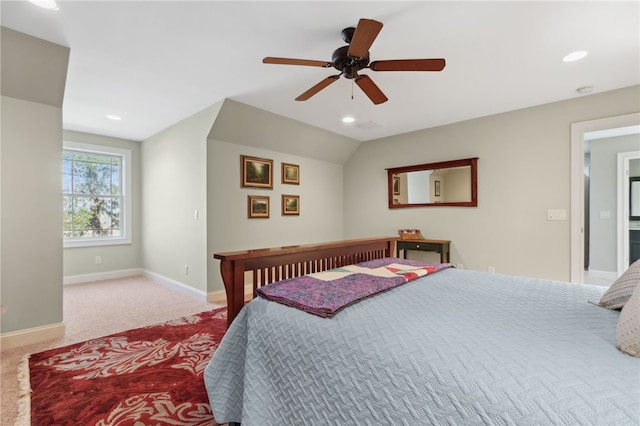 bedroom featuring ceiling fan, light carpet, and vaulted ceiling