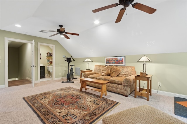 living room featuring light carpet, ceiling fan, and lofted ceiling