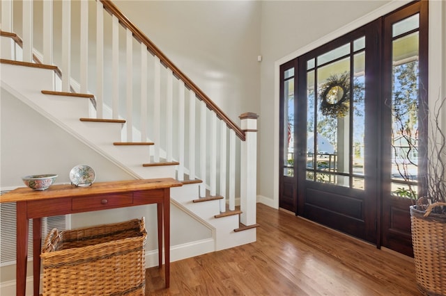 entryway with plenty of natural light and hardwood / wood-style flooring