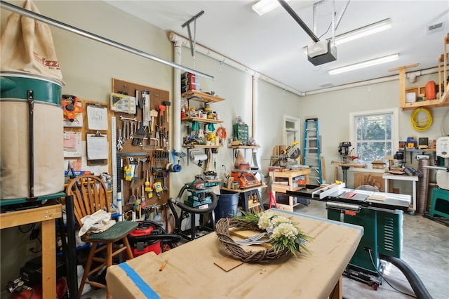 garage featuring a workshop area and a garage door opener