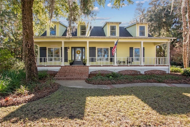 view of front of home with a porch and a front yard