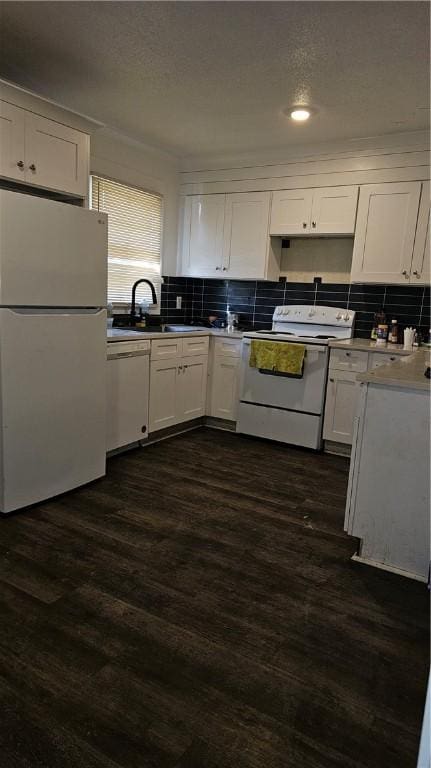 kitchen featuring dark wood-type flooring, white cabinetry, white appliances, and decorative backsplash