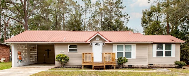 ranch-style house with a carport and a front lawn