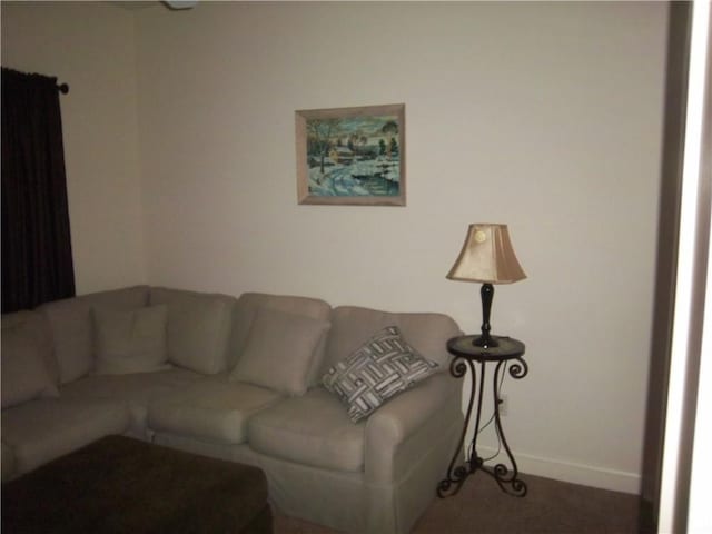 living area featuring baseboards