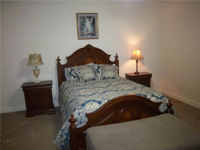 carpeted bedroom with baseboards