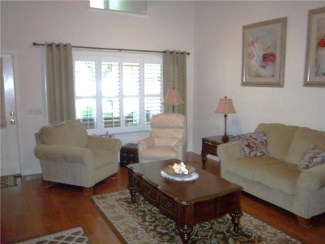 living room with wood finished floors and baseboards