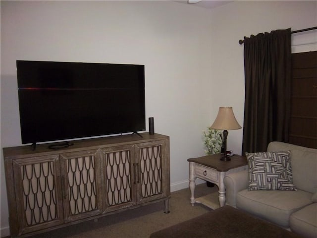 carpeted living room with baseboards