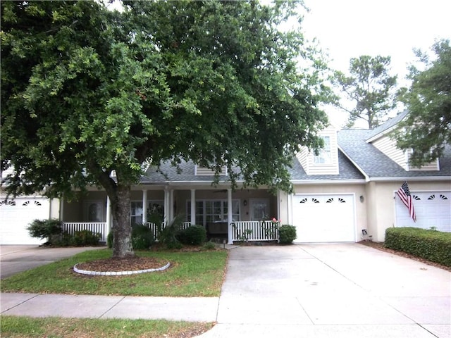 view of front of property featuring a porch, concrete driveway, stucco siding, a shingled roof, and a garage