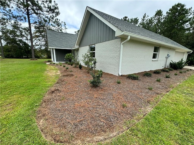 view of home's exterior with a lawn