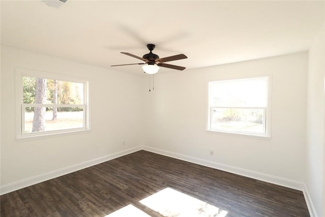 unfurnished room featuring ceiling fan and dark wood-type flooring